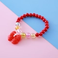 Kids colorful pearl bracelet featuring red round beads and a large bow pendant decoration - Red