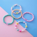 Set of 5 colorful beaded bracelets for girls with flower and butterfly charms - Set 2 (5 Pieces)