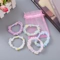Set di elastici per capelli in organza con girasoli in cinque colori pastello e borsa - Motivo Girasole