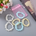 Fünf Haargummis aus Organza mit Sonnenblumendruck in Blau und Gelb sowie einer Geschenkbox - Beige Gelb Und Grün Mischung