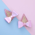 Horquillas con orejas de perro brillantes rosa y dorado con lazos - Rosa