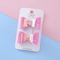 Set of two handmade glittery pink bow hair clips with shimmering center on a card - Rose Red