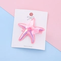 Glittery pink starfish hair clip for girls with a sheer ribbon bow on a display card - Pink Starfish