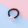 Elastic beaded ring featuring black faceted beads and an iridescent purple star charm - Star Style / Black