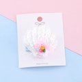 Seashell hair clip for girls featuring white sequins and pink bow on display card - White Shell