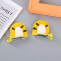 Pair of cute yellow tiger plush hair clips for girls featuring vivid black stripes - Yellow Tiger