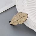 Sparkly gold sequin leaf hair clip with elegant black veins on a duckbill hair pin - Gold Leaf Hair Clip