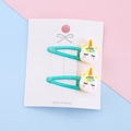 Zwei türkisfarbene Einhorn-Haarspangen mit Pailletten für Kinder auf einer Karte - Türkises Einhorn (2#)