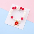 Kids Christmas pearl bracelet featuring red white beads and cute Santa hat snowflake charm - White Christmas Hat Style