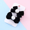 Pair of elegant black velvet bow hair clips with white pearls on a display card - Black