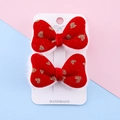 Set of two red velvet hair clips with gold glitter hearts on a handmade display card - Red Velvet Gold Heart Style