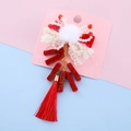 Fermaglio Capodanno Cinese per bimbi con pompon bianco perla e lunghe nappe - Petardo Nappina