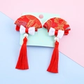 Pair of red Chinese New Year hair clips with fans, tassels, and pearl bows for girls - Fan