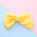 Handmade bright yellow polyester fabric bow hair clip for girls on colorful background - Yellow