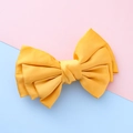 Bright yellow fabric bow hair clip for girls with elegant pleated texture on dual background - Ginger Yellow