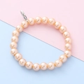Kralenarmband van imitatieparels in abrikoos met zilveren karabijnsluiting voor kind - Kralen Creolen / Champagne
