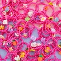 Colorful kids beaded bracelets set featuring resin rabbit and flower charms in hot pink - Rose Red