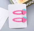 Close-up of strawberry hair clips with pink glitter detail and green leaves on white card - Fuchsia Strawberry / Without Cardboard Packaging