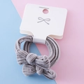 Elastic dark gray velvet hair ties with bow accents on a white display card - Dark Gray