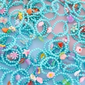 Kids cute blue beaded bracelets with cartoon charms like flowers, rabbits and unicorns - Blue