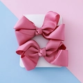 Pair of rose pink ribbed grosgrain ribbon bow hair clips for kids on a white card - Deep Pink