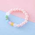 Pink pearl beaded bracelet for girls with colorful resin charms on pastel background - Pink Antique Style