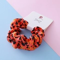 Bright orange Halloween scrunchie with black spider and pumpkin prints on satin fabric - Red Pumpkin Style