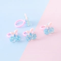 Set di quattro anelli rosa per bambini con ciliegie glitter blu e piccoli fiocchi - Stile Ciliegia