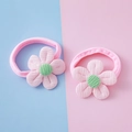 Pink corduroy flower elastic hair ties for girls on a soft pastel blue and pink background - Pink