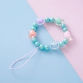Blue faux pearl phone charm with transparent acrylic heart beads and a pink lanyard strap - Blue
