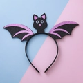 Cerchietto di Halloween con ali di pipistrello glitter viola e occhi mobili per feste - Viola