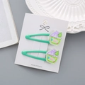 Lot de deux pinces à cheveux vertes avec motif cupcake en résine sur carte - Crème Glacée Verte