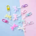 Porte-clés nœuds en acrylique coloré en sept tons pastel pour décorer les sacs - Nœud Personnalisable