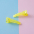 Yellow translucent 3.5cm jelly hair clips with metal springs on a colorful background - Jelly Yellow