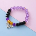 Halloween beaded bracelet featuring purple, black, and yellow beads with silver bat charm - Bat