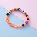 Halloween beaded bracelet with orange letter beads and colorful bat-themed clay discs - HALLOWEEN Letter Bead Style / Text