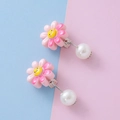 Pink resin sunflower clip-on earrings with a smiling face and white pearl pendant - Smiling Flower