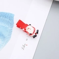 Primer plano de una pinza para el cabello navideña con figura 3D de Papá Noel - Pinza de Pelo Papá Noel