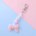 Portachiavi con fiocco rosa e perline dolci per decorazione di borse e zaini - Fiocco