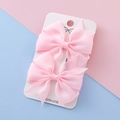 Pair of light pink grosgrain ribbon bow hair clips on handmade display card - Light Pink