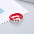 Close-up of a red elastic hair tie with a resin Santa Claus decoration for Christmas - Santa Hat Hair Tie