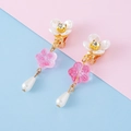 Pink floral clip-on earrings with white resin petals and dangling faux pearls - Clip-On Earrings