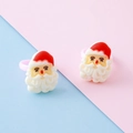 Festive Santa Claus resin rings for kids featuring red hats and pink bands in a two-piece set - Santa Claus Head Style 2