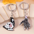 Gotisches Set aus Emaille-Schlüsselanhängern mit Totenkopf und Raben-Motiv - Totenkopf Und Skeletthand Set