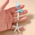 Detail of starfish keychain with blue striped beads and glitter sea star pendant - Blue Starfish