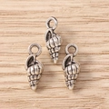 Macro view of three vintage silver conch shell charms for DIY jewelry making - 30Pcs Pack / Conch