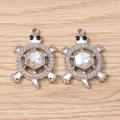 Close-up of silver turtle pendants with rhinestones and iridescent crystals for DIY jewelry - Turtle (3061) / 5 Pieces / Silver with White Rhinestones