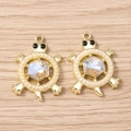 Macro detail of golden sea turtle pendants with rhinestones and faux pearls on wood - Turtle (3061) / 5 Pieces / Gold White Artificial Pearl