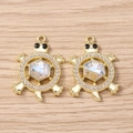 Detailed view of turtle pendants with golden finish and iridescent crystal inlay - Turtle (3061) / 5 Pieces / Gold with White Rhinestones