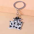Ghost keychain with black and white cow print texture and black hat detail - Black White Ghost